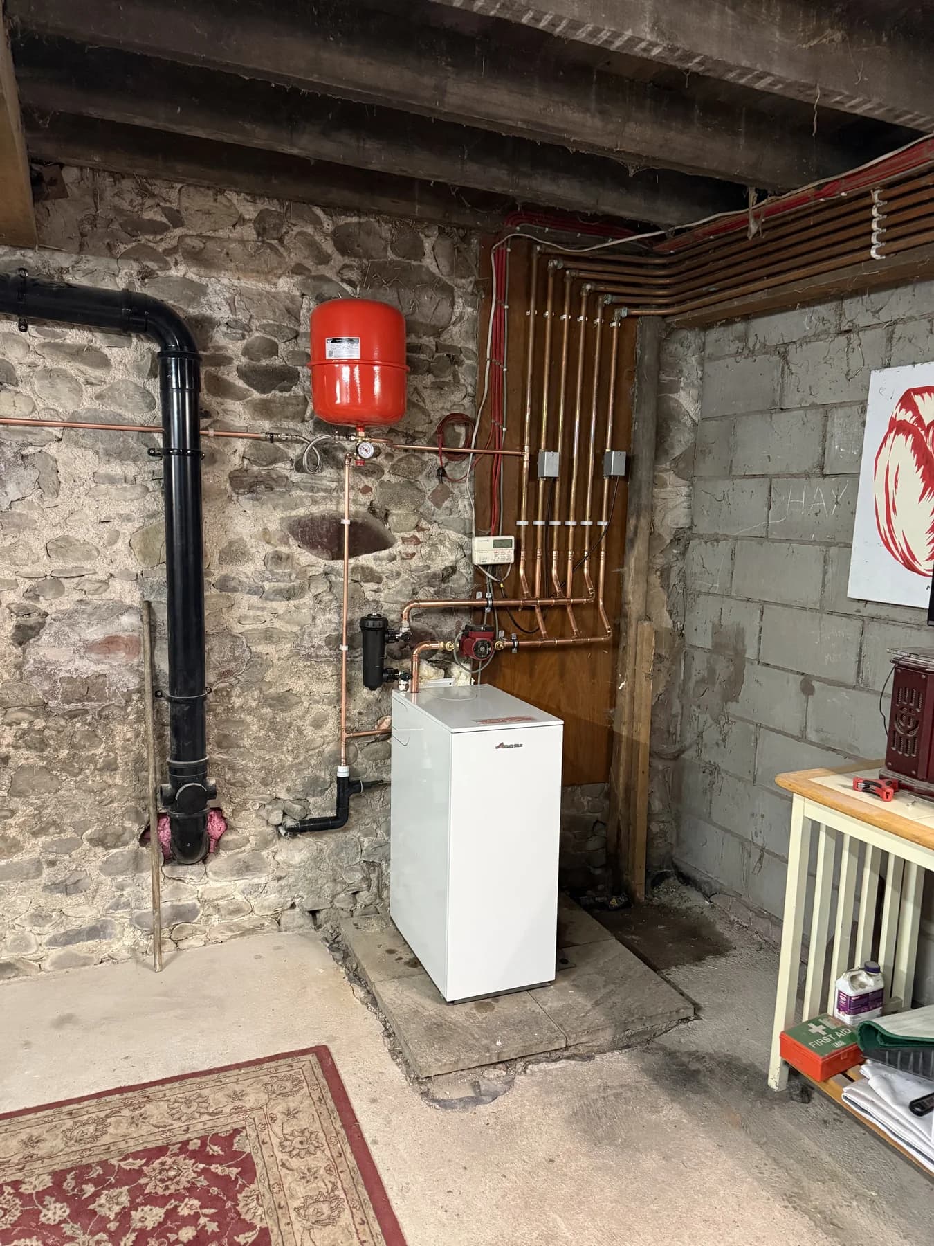 Floor-standing boiler and neatly routed copper heating pipework installed by CKR Plumbing and Heating
