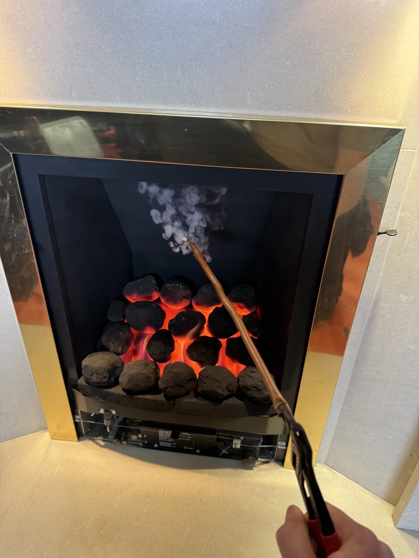 Gas fire being tested and serviced by CKR Plumbing and Heating